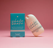 Shake Shake sunscreen bottle and packaging on a pink background