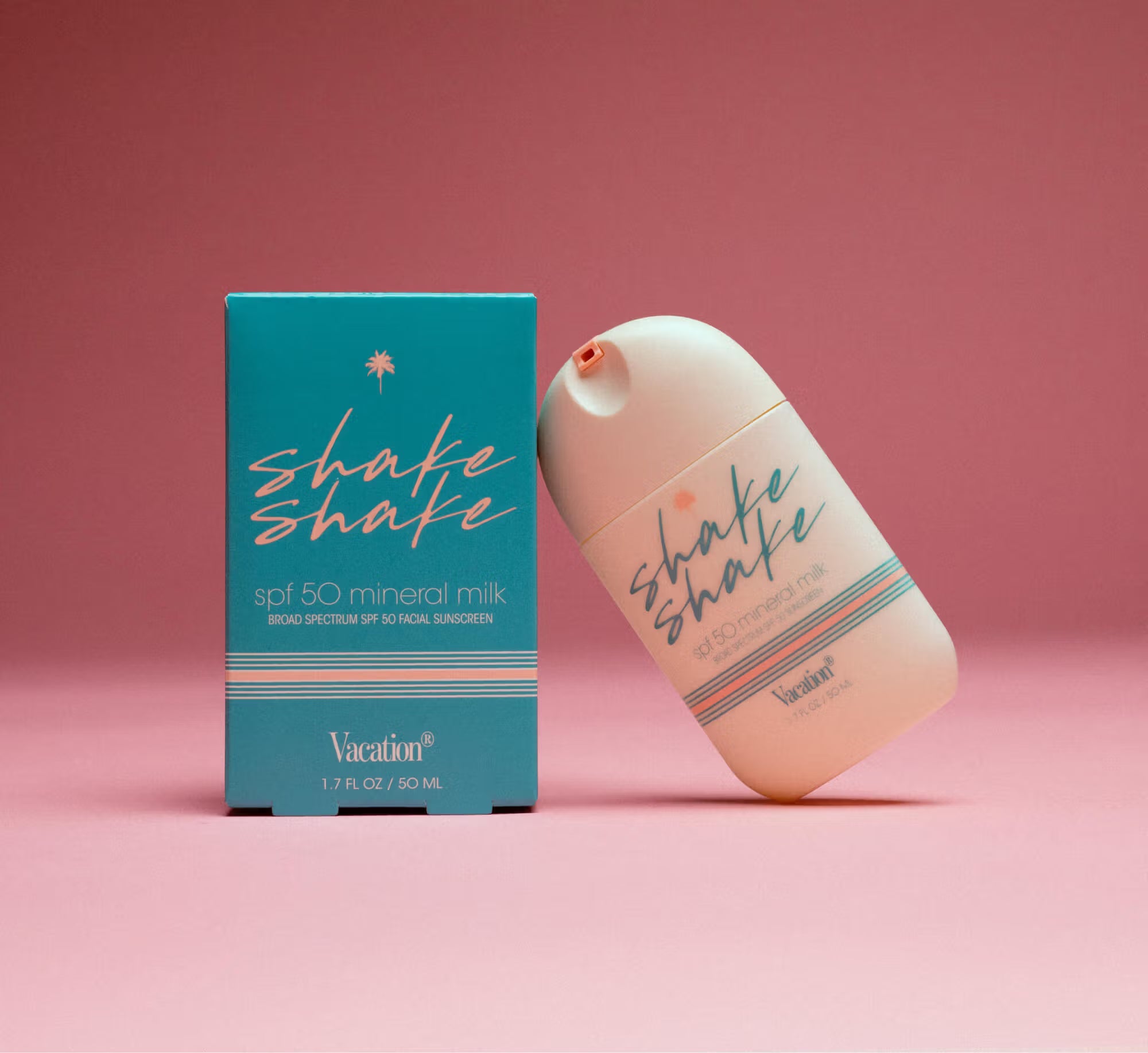 Shake Shake sunscreen bottle and packaging on a pink background